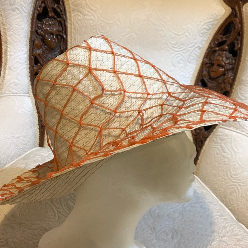 White straw  sun hat with coral netting.